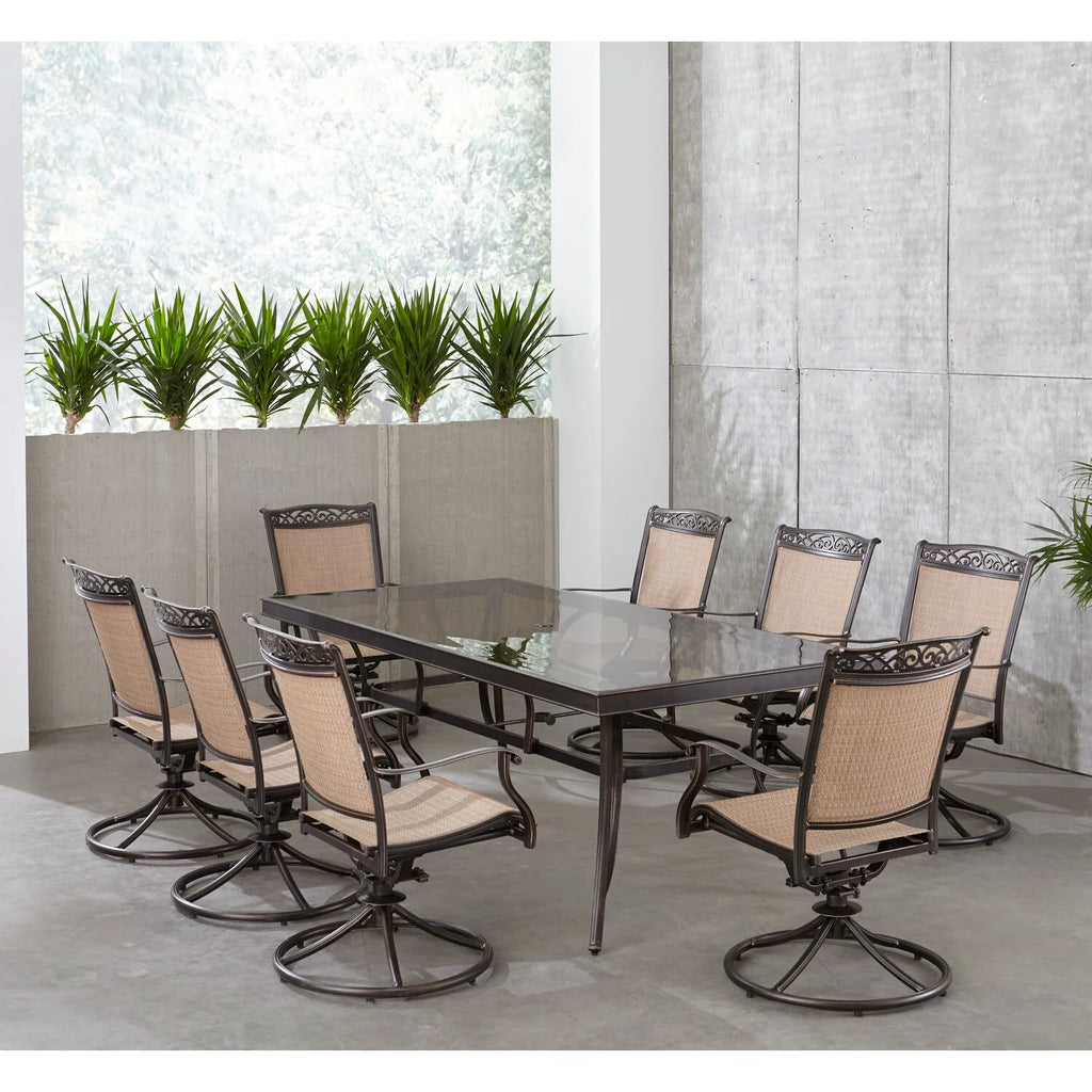9-Piece Outdoor Dining Set with Swivel Rockers and Glass-Top Table O975